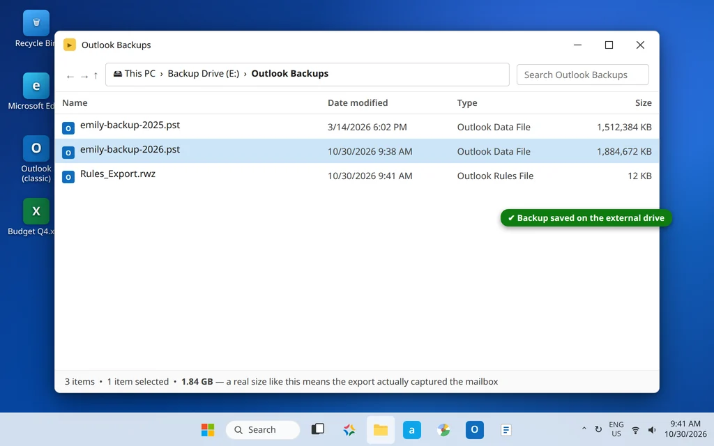 File Explorer showing the exported PST backup file on an external drive with its size