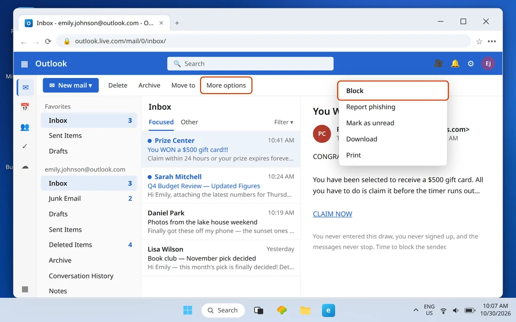 Outlook.com message open with the More options menu showing the Block option highlighted