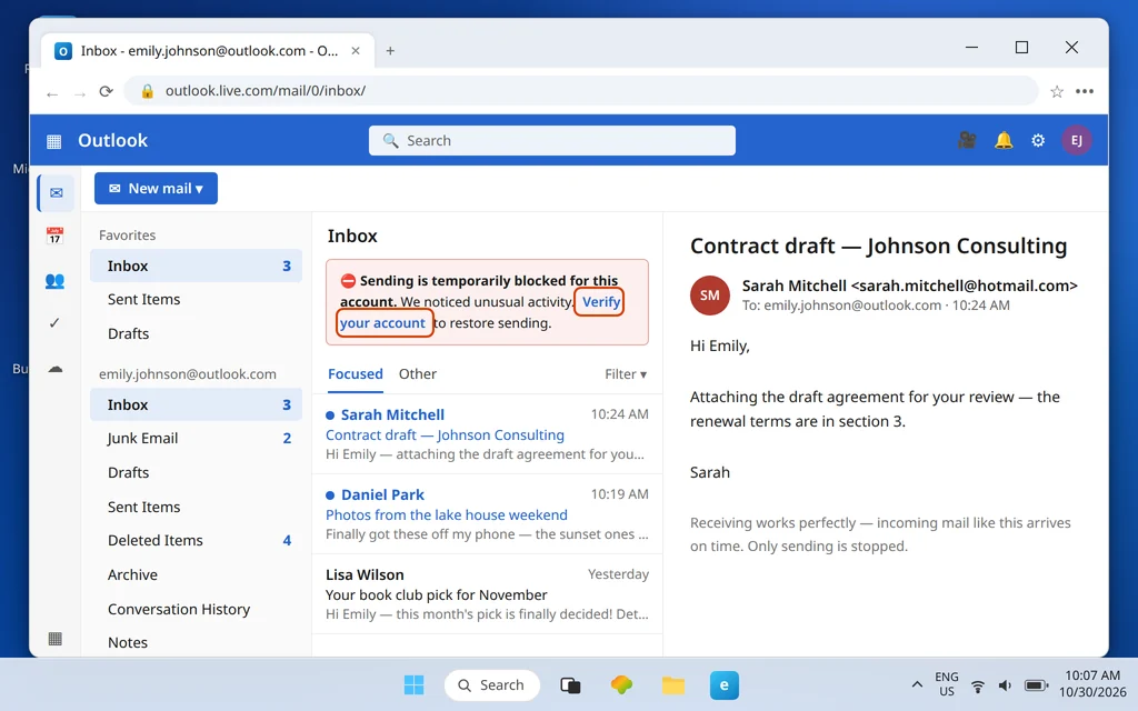Outlook.com inbox showing the sending is temporarily blocked banner with a verify your account link while incoming mail still arrives