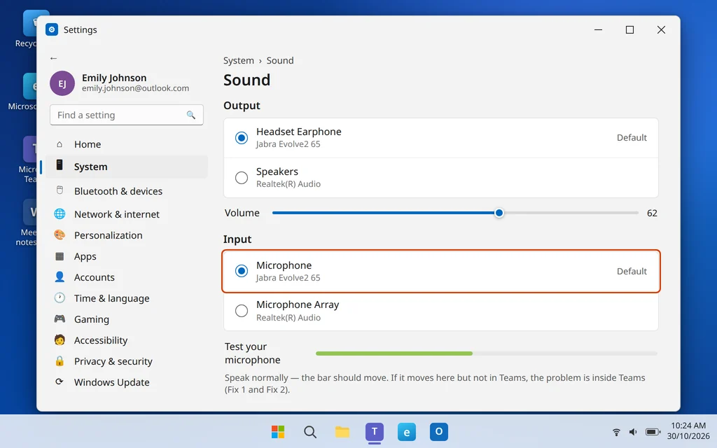 Windows 11 Sound settings showing the default input microphone and output device